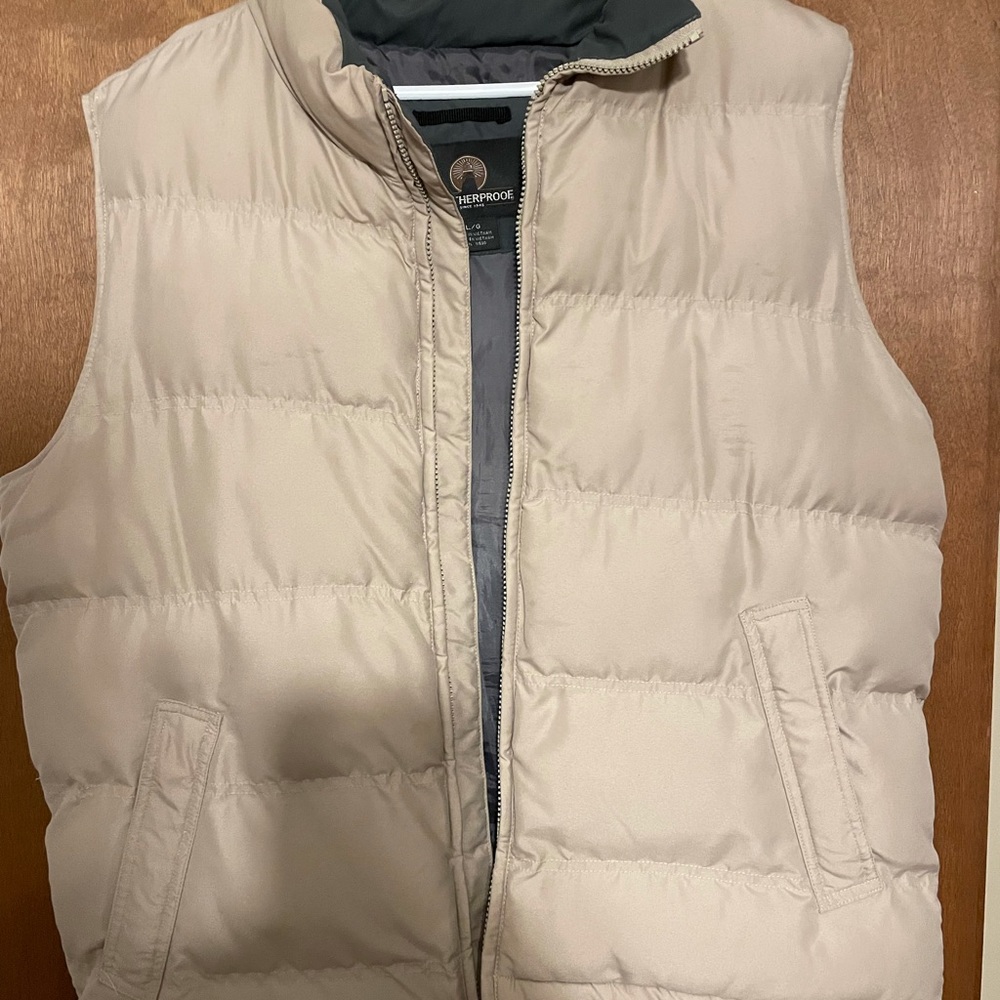 Slightly used weatherproof Light tan vest